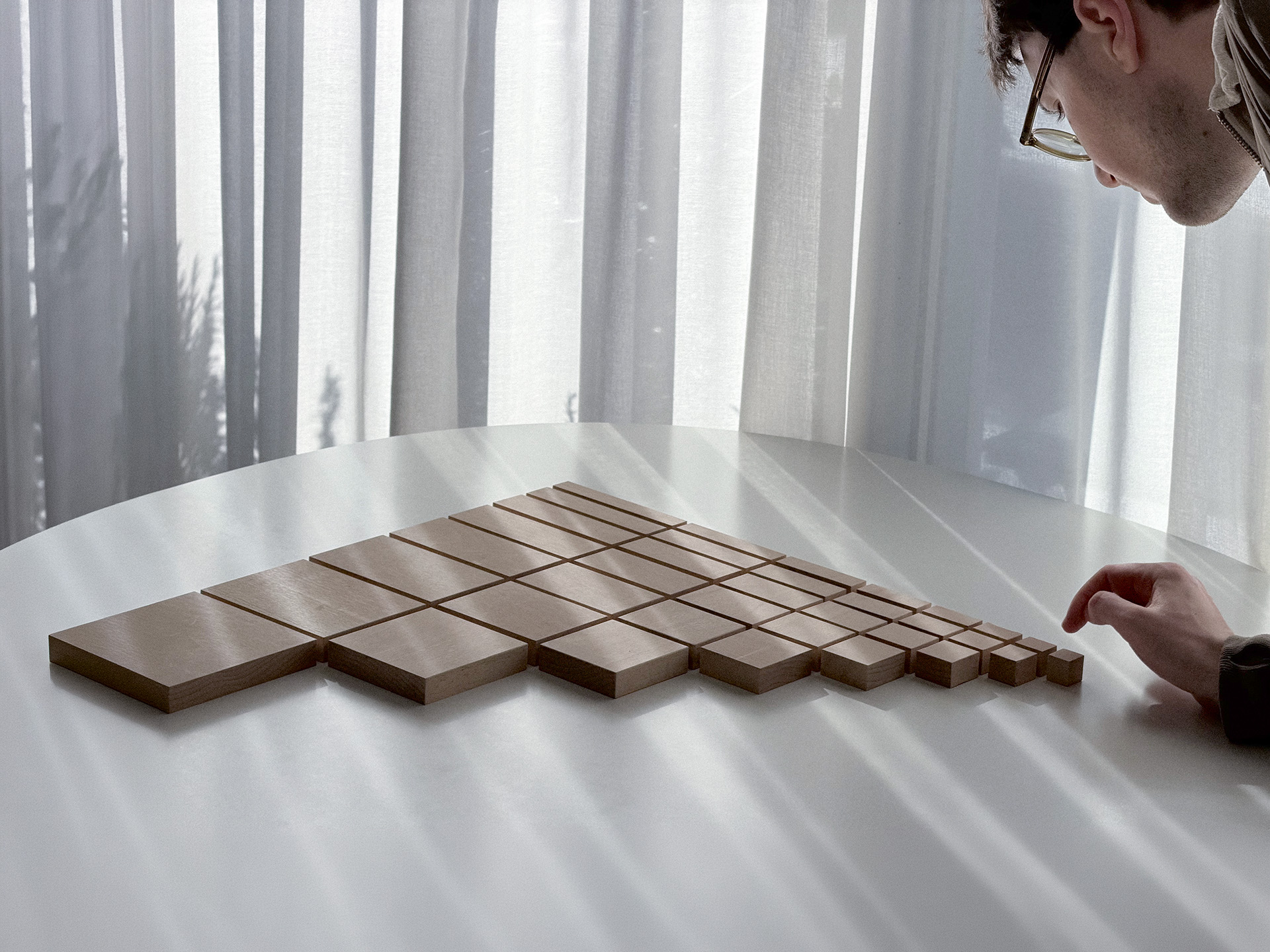 Learning to See wooden forms on a table.